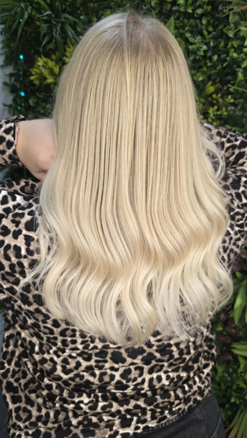The same very light blonde hairstyle, seen from slightly above in brighter light — hair by Jowita Litwin, Goleniów