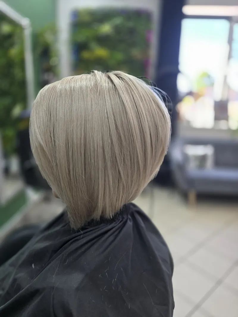 Another view of the asymmetric ash blonde bob from the side and back — hair by Jowita Litwin, Goleniów